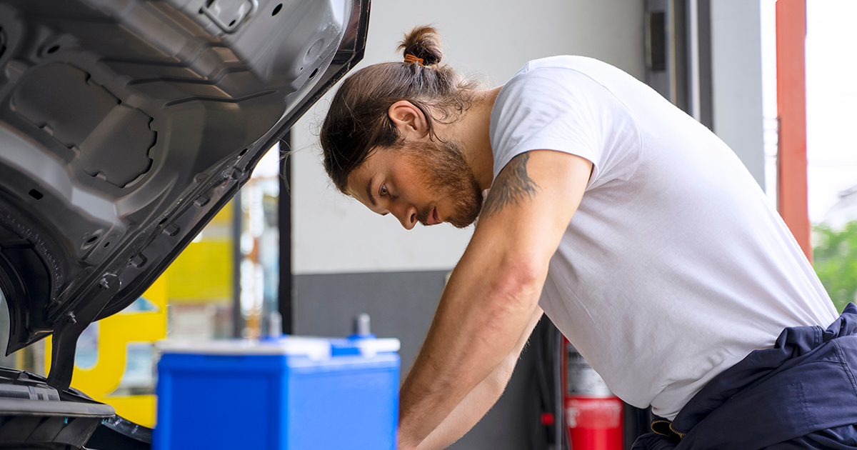 man_working_on_engine